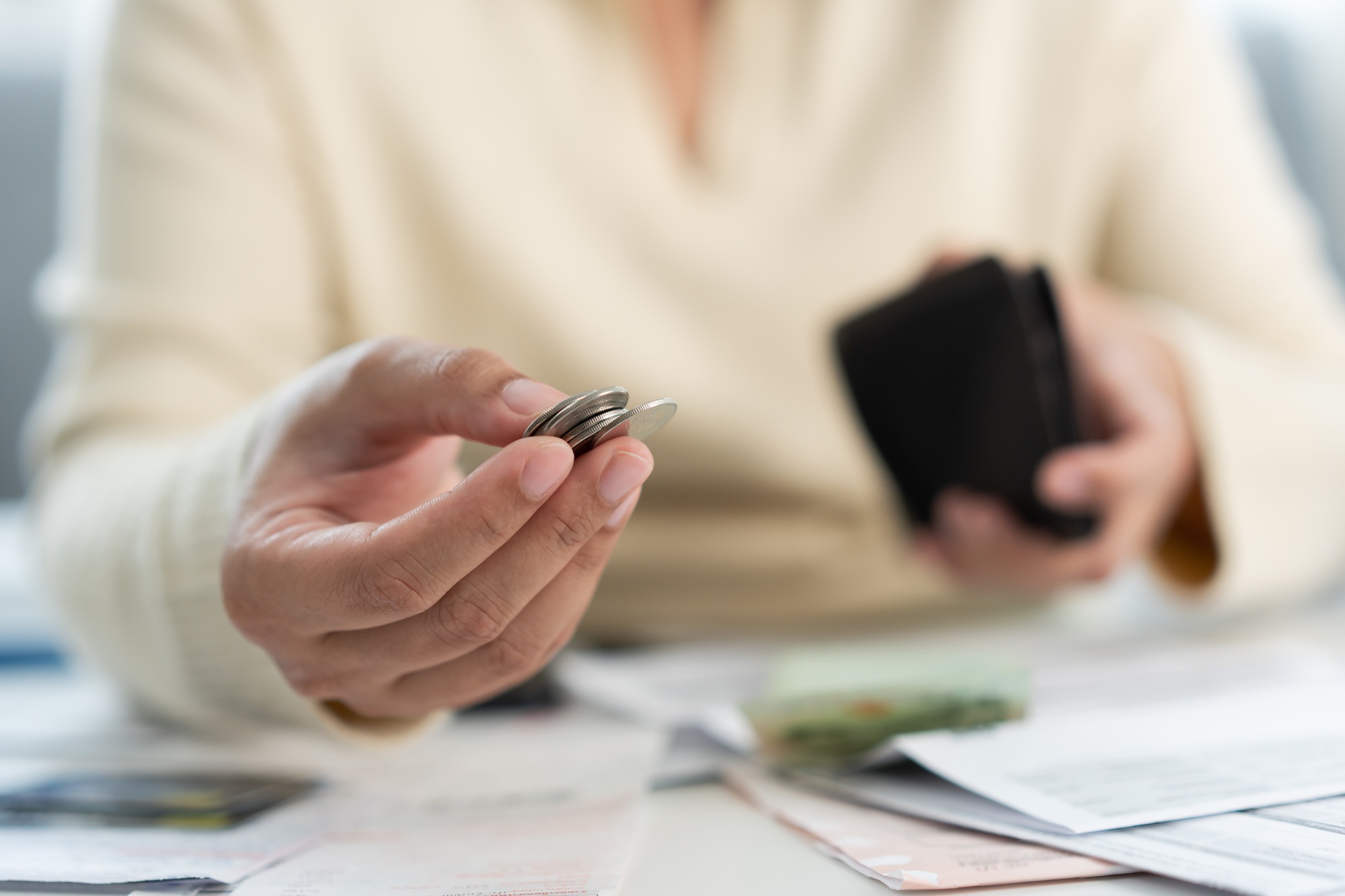 Worried unemployment woman open empty wallet on payday